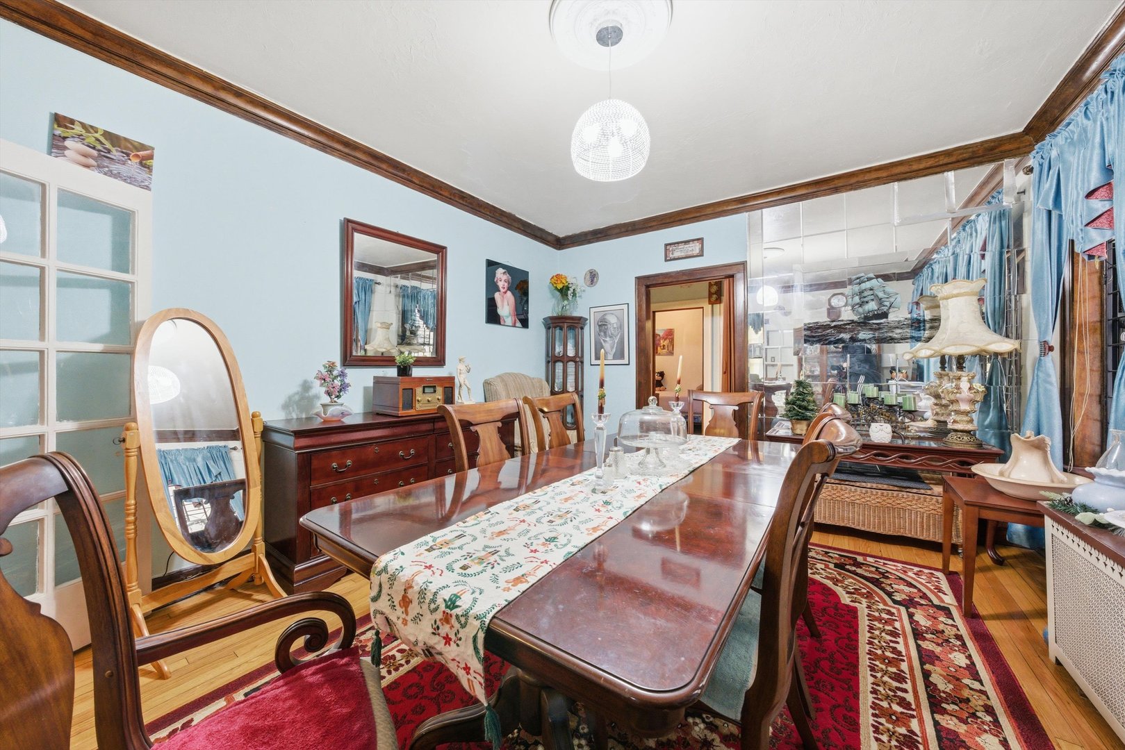 8019 South Rhodes Avenue Chicago, IL 60619 - Photo 6 of 55 a view of a dining room with furniture window and wooden floor