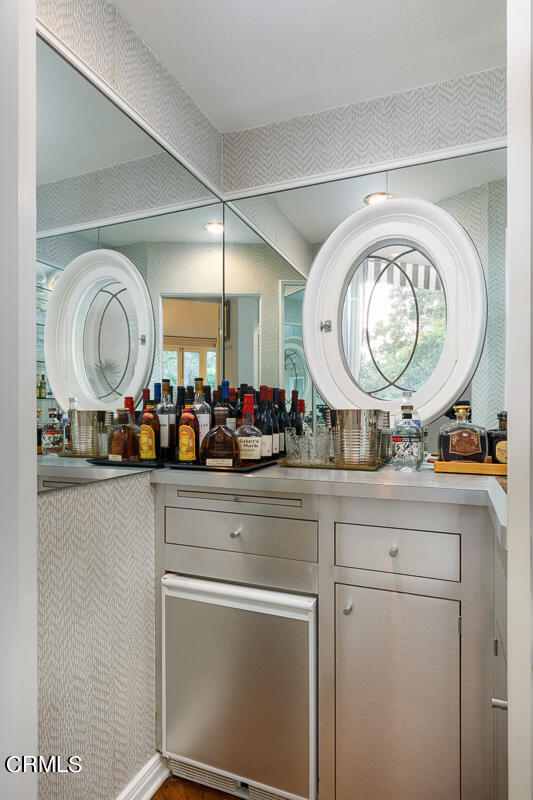 465 South San Rafael Avenue Pasadena, CA 91105 - Photo 28 of 75 a living room with furniture and a mirror