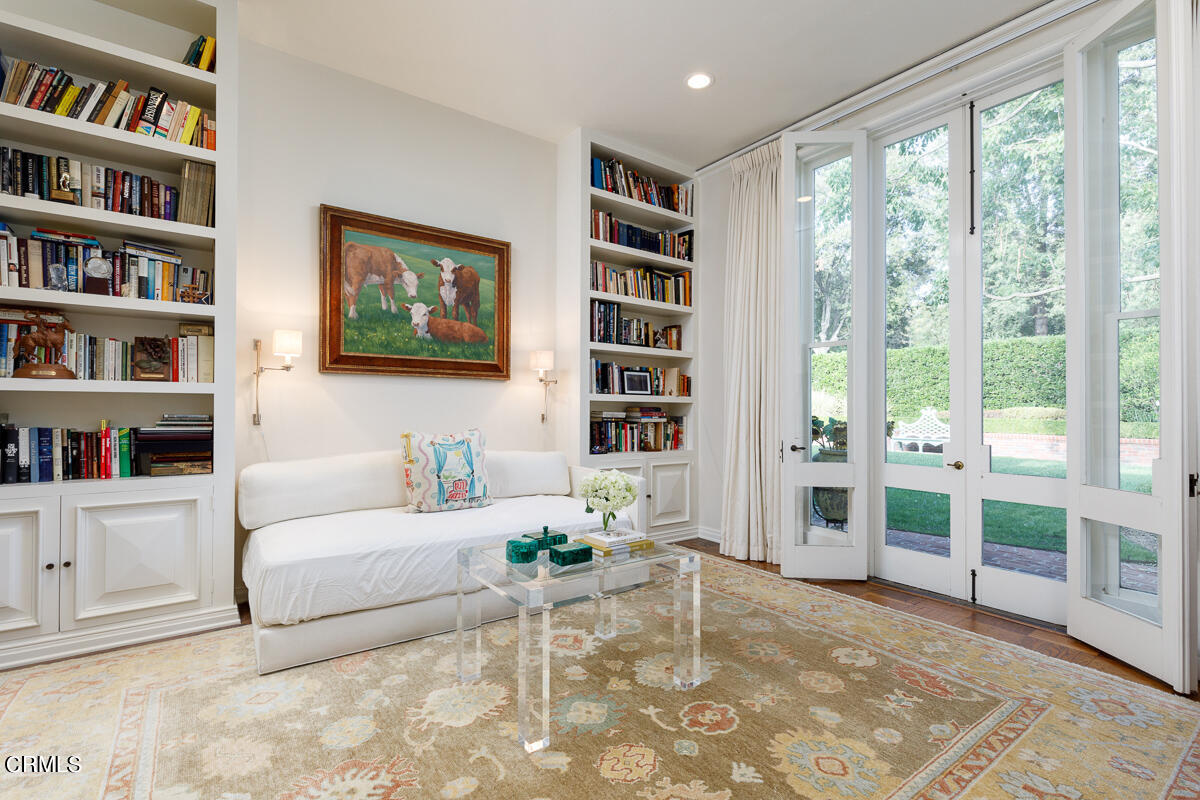 465 South San Rafael Avenue Pasadena, CA 91105 - Photo 29 of 75 a living room with furniture and a book shelf