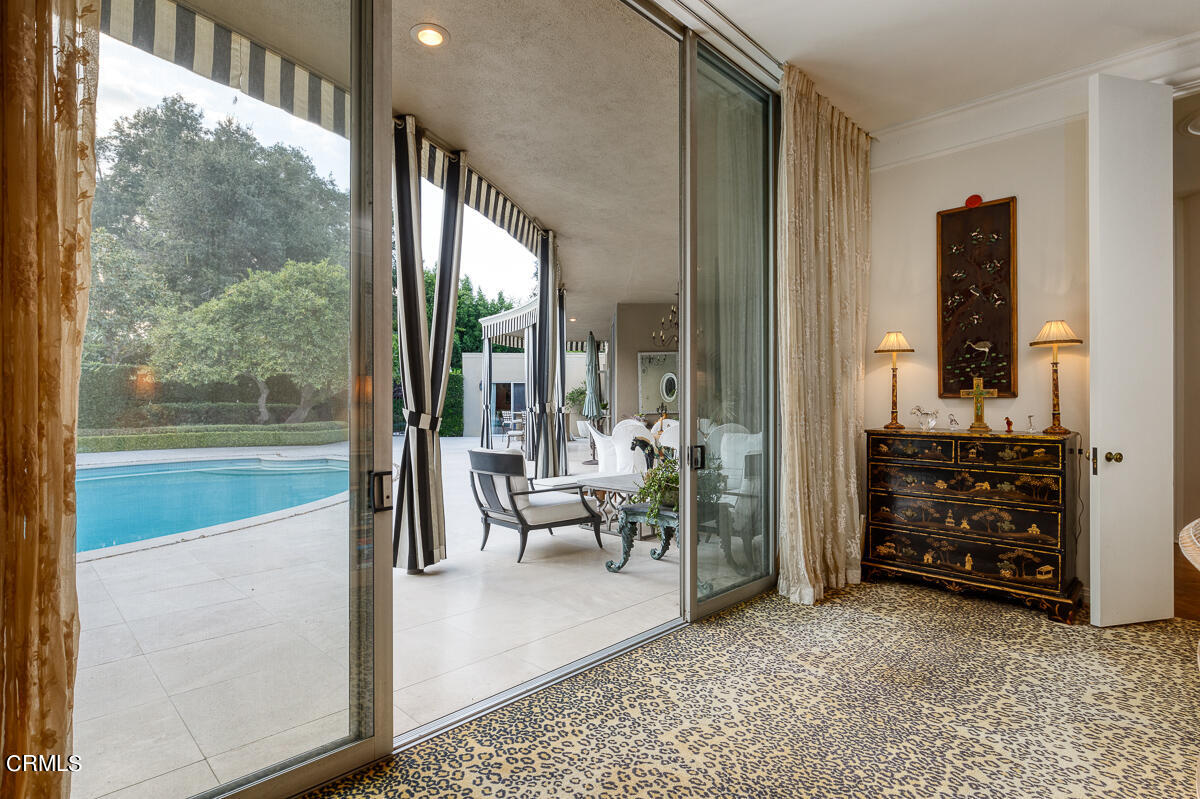 465 South San Rafael Avenue Pasadena, CA 91105 - Photo 36 of 75 a living room with furniture and a floor to ceiling window