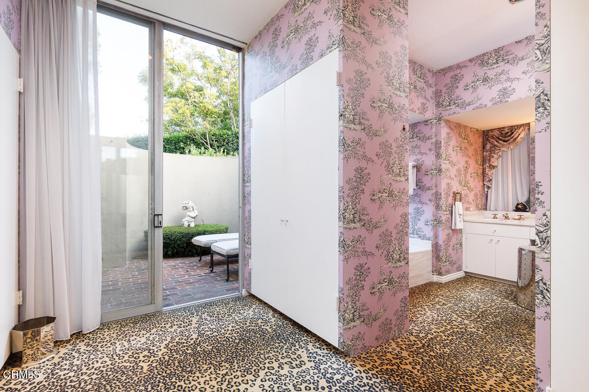 465 South San Rafael Avenue Pasadena, CA 91105 - Photo 40 of 75 a bathroom with a granite countertop sink a toilet and a window