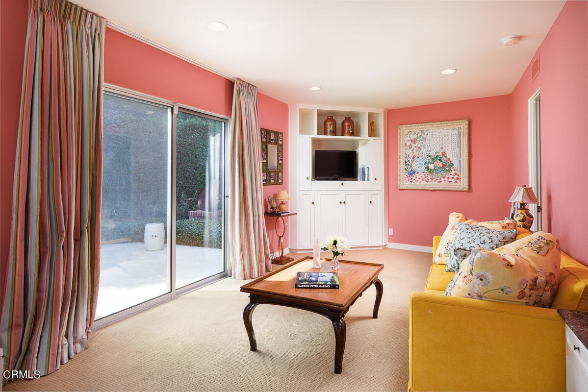 465 South San Rafael Avenue Pasadena, CA 91105 - Photo 42 of 75 a living room with furniture and a flat screen tv