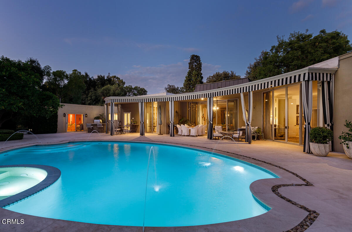 465 South San Rafael Avenue Pasadena, CA 91105 - Photo 44 of 75 a swimming pool with outdoor seating and yard in the back