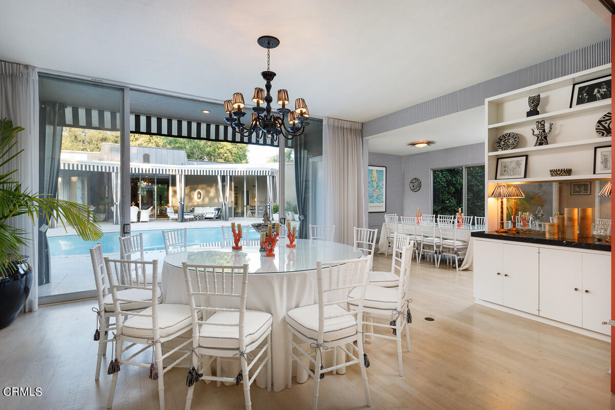 465 South San Rafael Avenue Pasadena, CA 91105 - Photo 46 of 75 a view of a dining room with furniture and chandelier