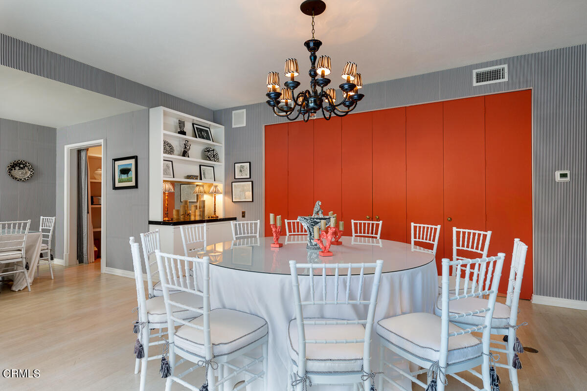 465 South San Rafael Avenue Pasadena, CA 91105 - Photo 49 of 75 a view of a dining room with furniture and chandelier