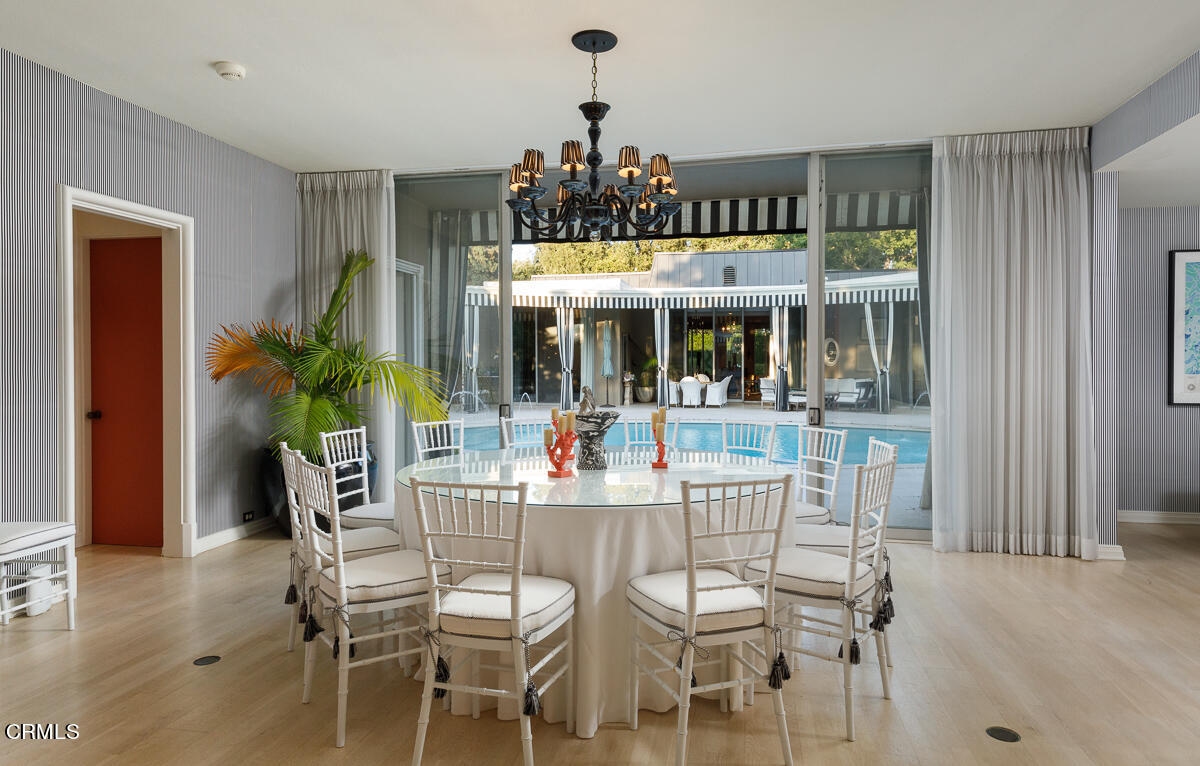 465 South San Rafael Avenue Pasadena, CA 91105 - Photo 54 of 75 a view of an dining room with furniture and chandelier