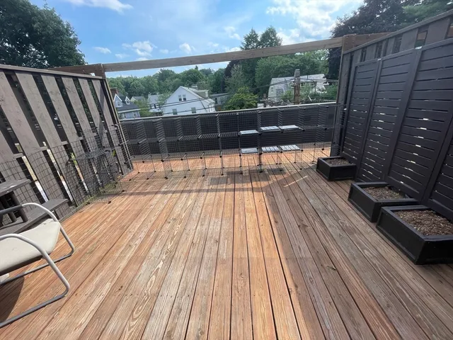a view of balcony with wooden floor