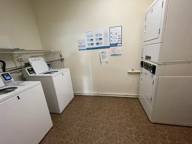 a view of a storage & utility room with a refrigerator