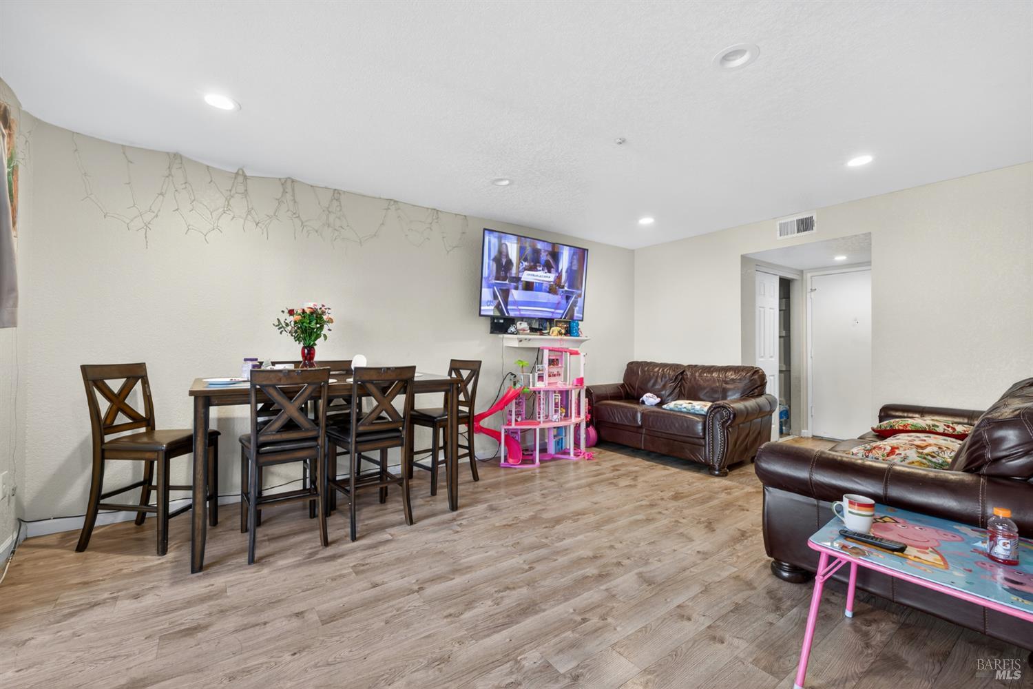 497 Sebastopol Avenue Santa Rosa, CA 95401 - Photo 17 of 42 a living room with lots of furniture and a wooden floor