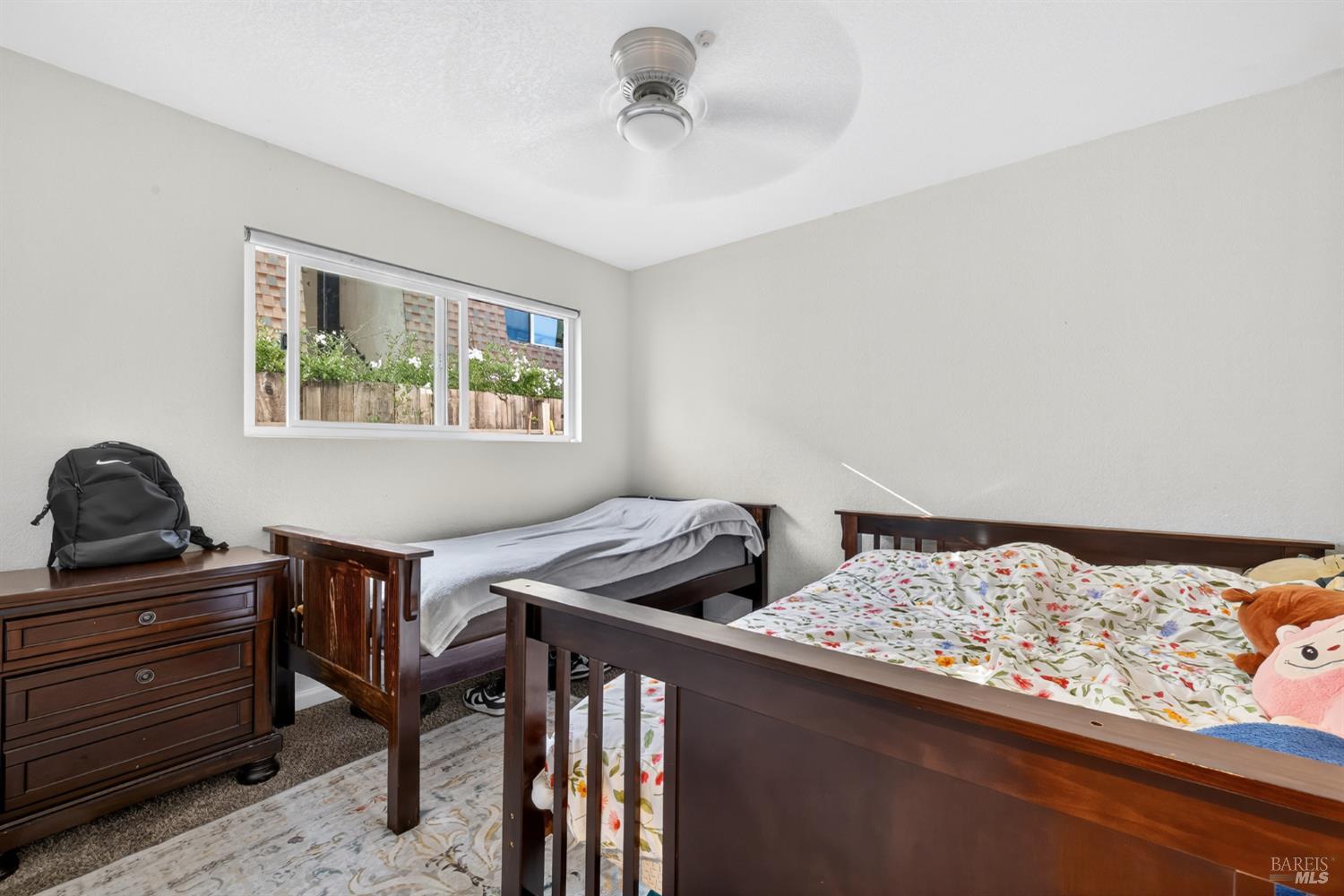 497 Sebastopol Avenue Santa Rosa, CA 95401 - Photo 19 of 42 a bedroom with a bed and a window