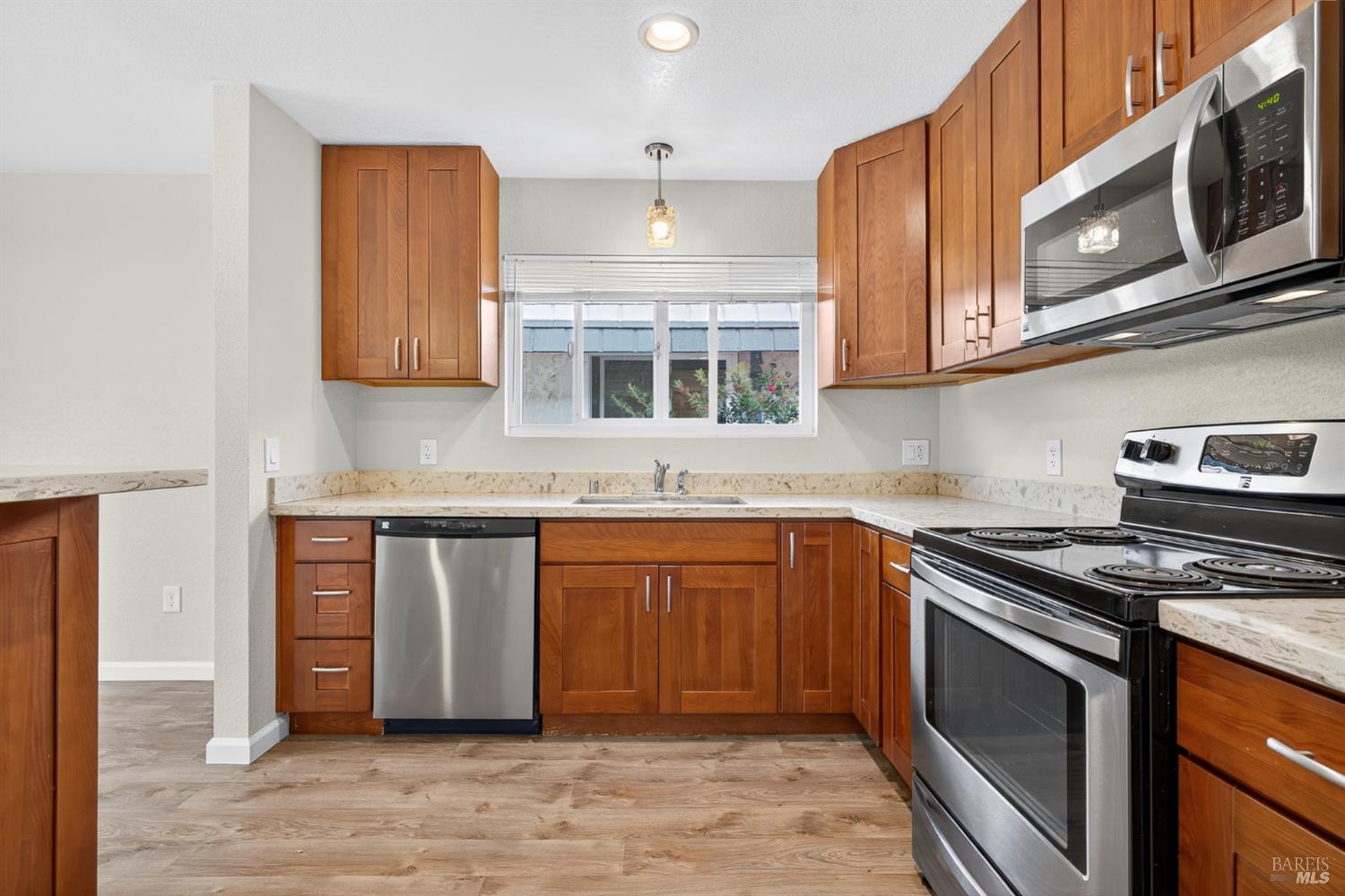 497 Sebastopol Avenue Santa Rosa, CA 95401 - Photo 3 of 42 a kitchen with stainless steel appliances granite countertop a stove and a microwave