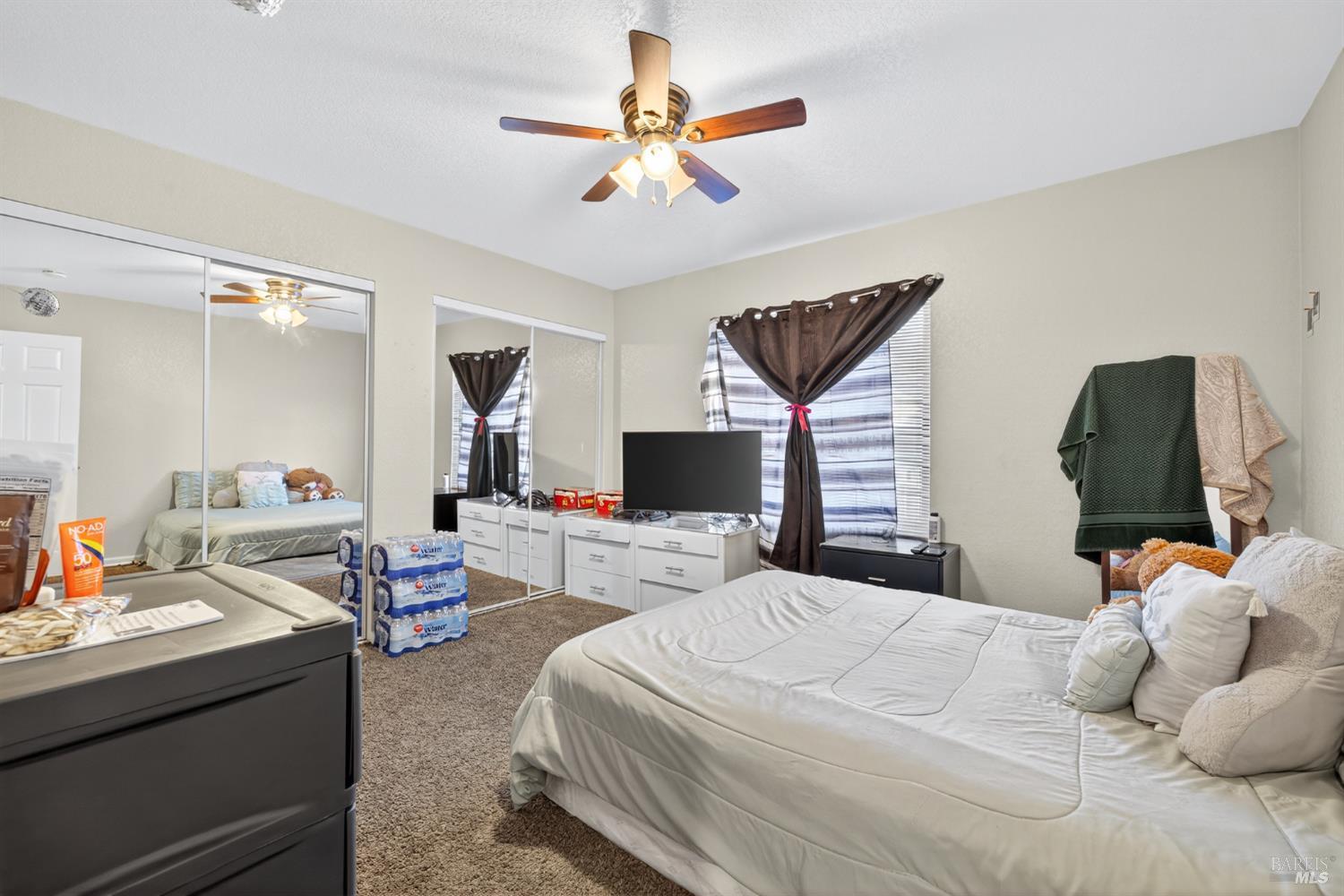 497 Sebastopol Avenue Santa Rosa, CA 95401 - Photo 31 of 42 a bedroom with a bed and a chandelier