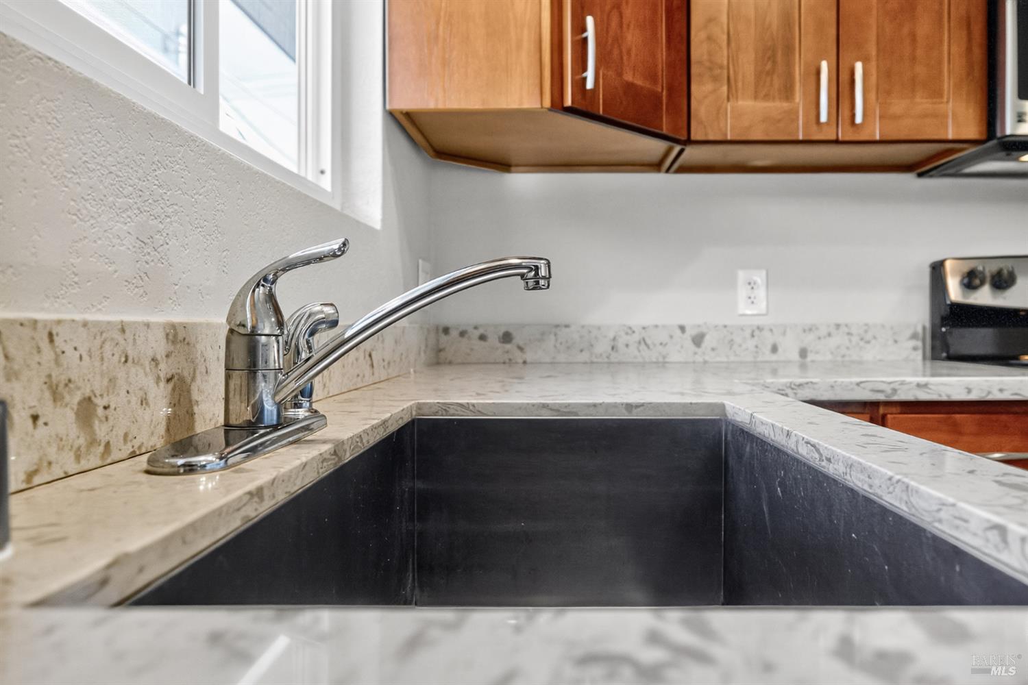 497 Sebastopol Avenue Santa Rosa, CA 95401 - Photo 7 of 42 a kitchen with a sink and cabinets