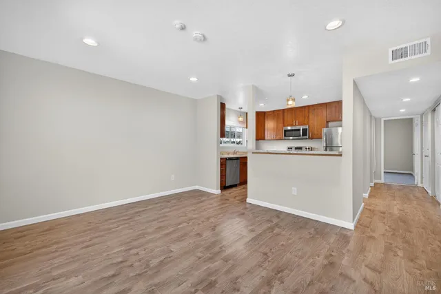 a view of kitchen with wooden floor