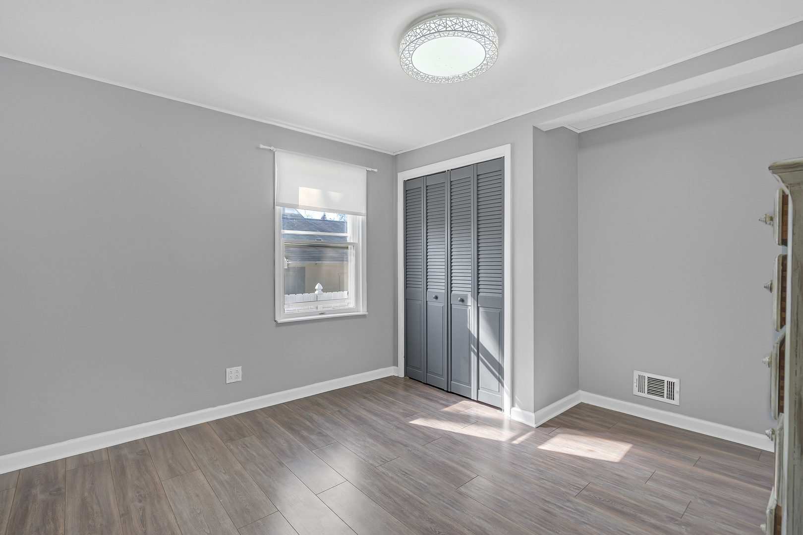 886 West Palatine Road Palatine, IL 60067 - Photo 15 of 27 an empty room with wooden floor and windows