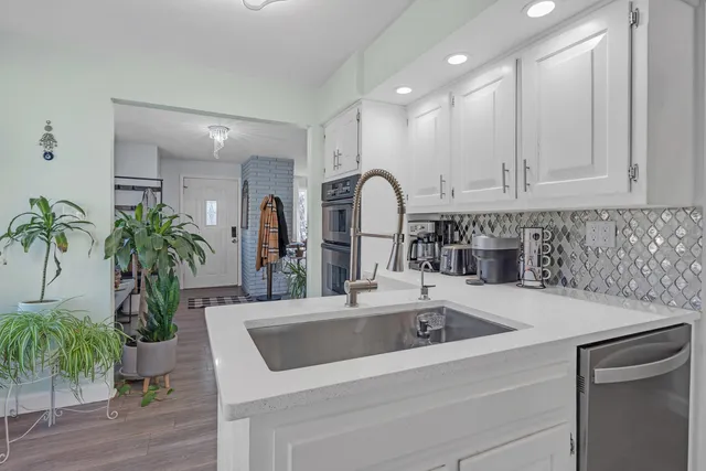 a kitchen with a sink and a refrigerator