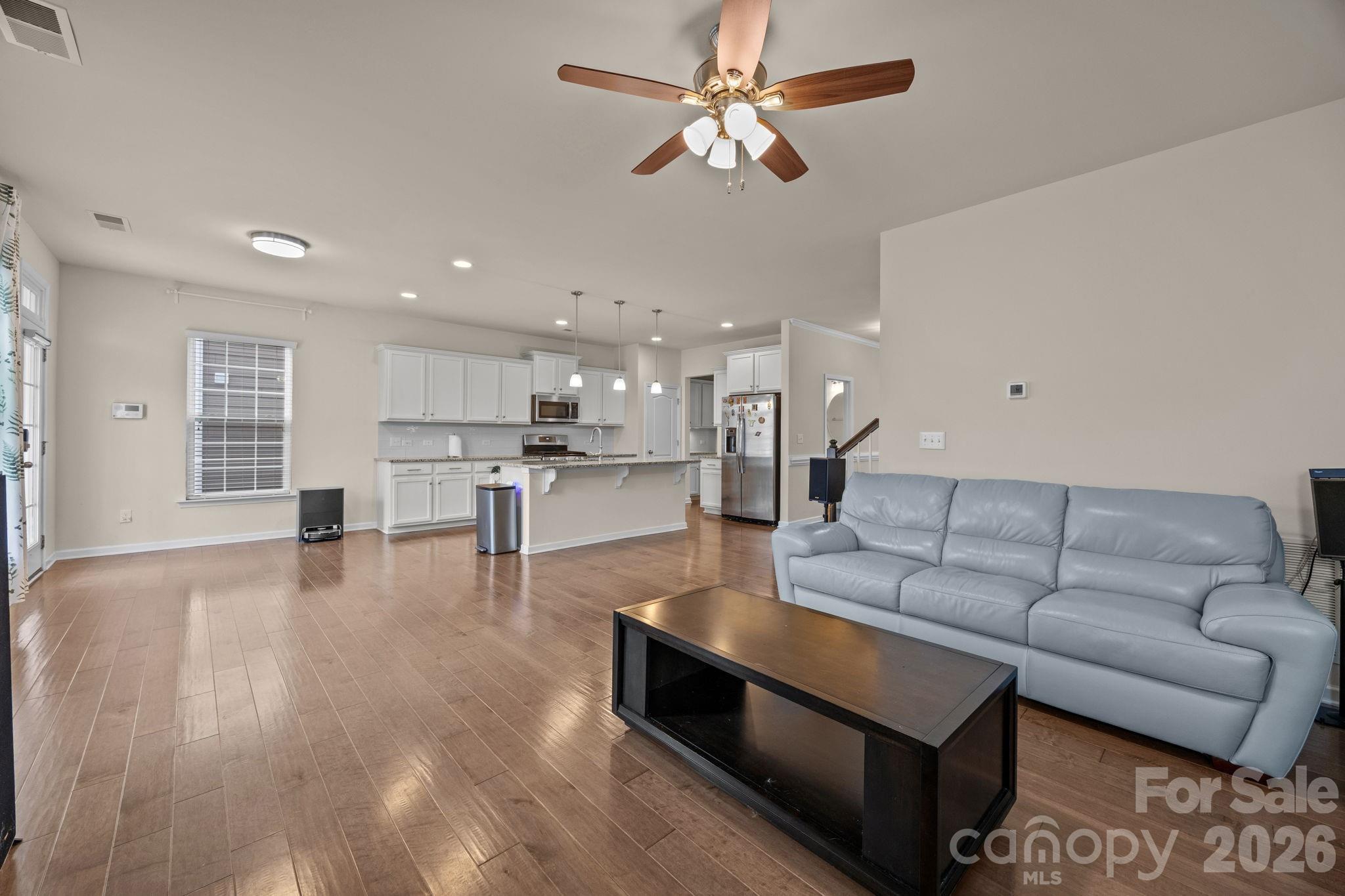 4028 Whittier Lane Tega Cay, SC 29708 - Photo 16 of 46 a living room with furniture and kitchen view