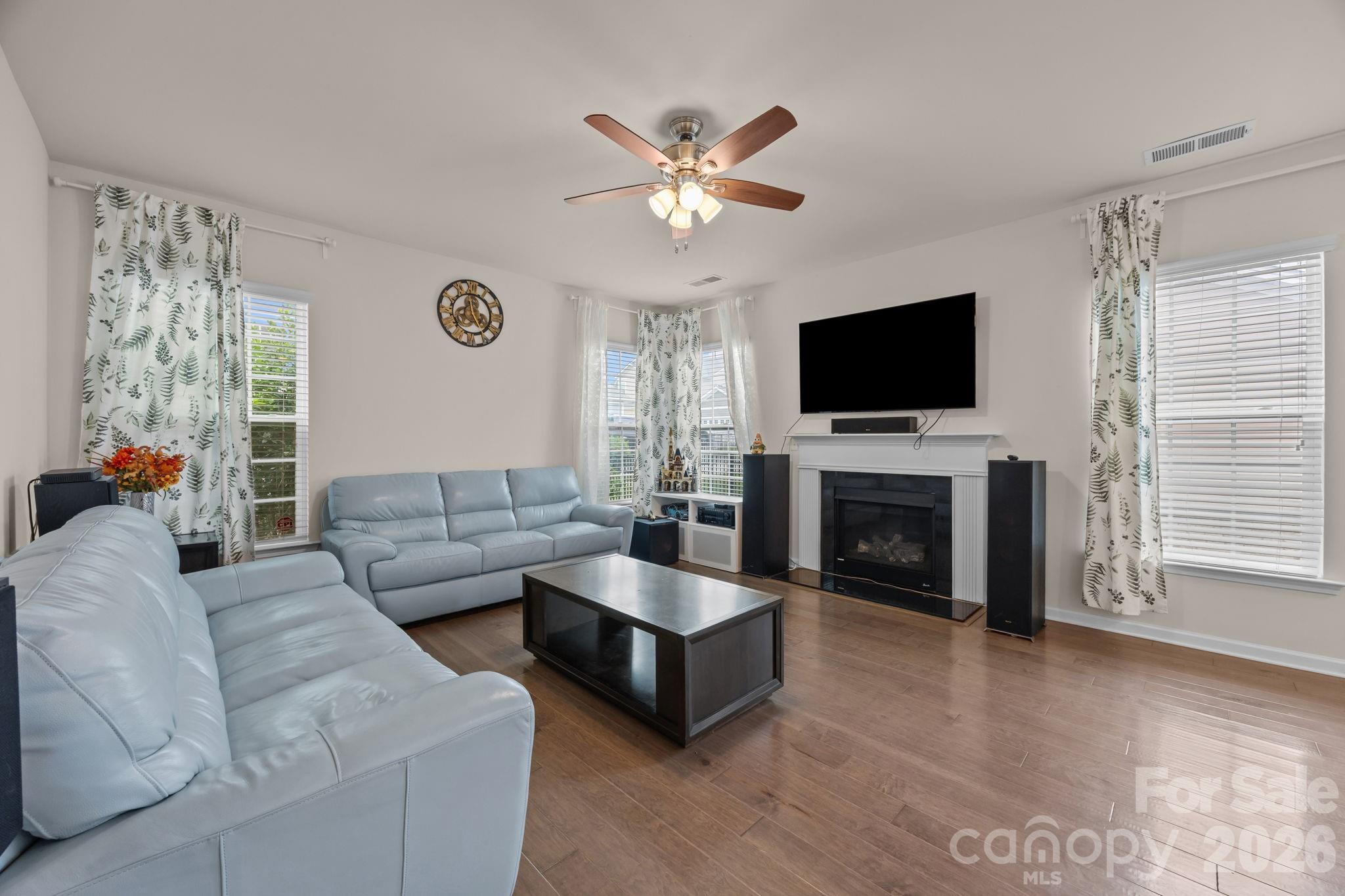 4028 Whittier Lane Tega Cay, SC 29708 - Photo 18 of 46 a living room with fireplace furniture and a flat screen tv