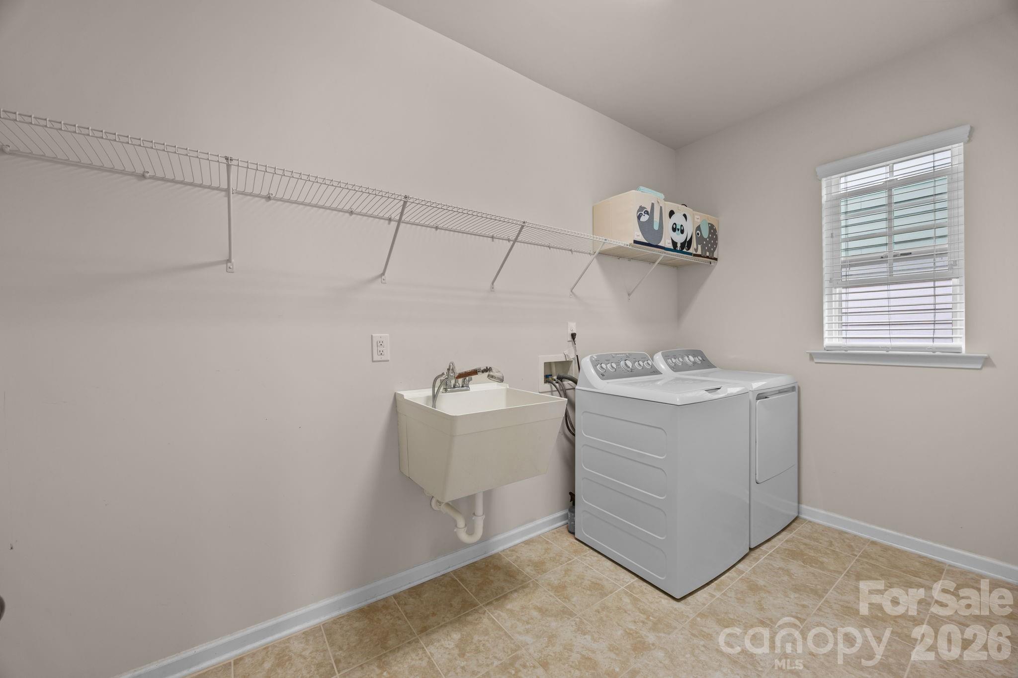 4028 Whittier Lane Tega Cay, SC 29708 - Photo 19 of 46 a view of a storage & utility room with a sink