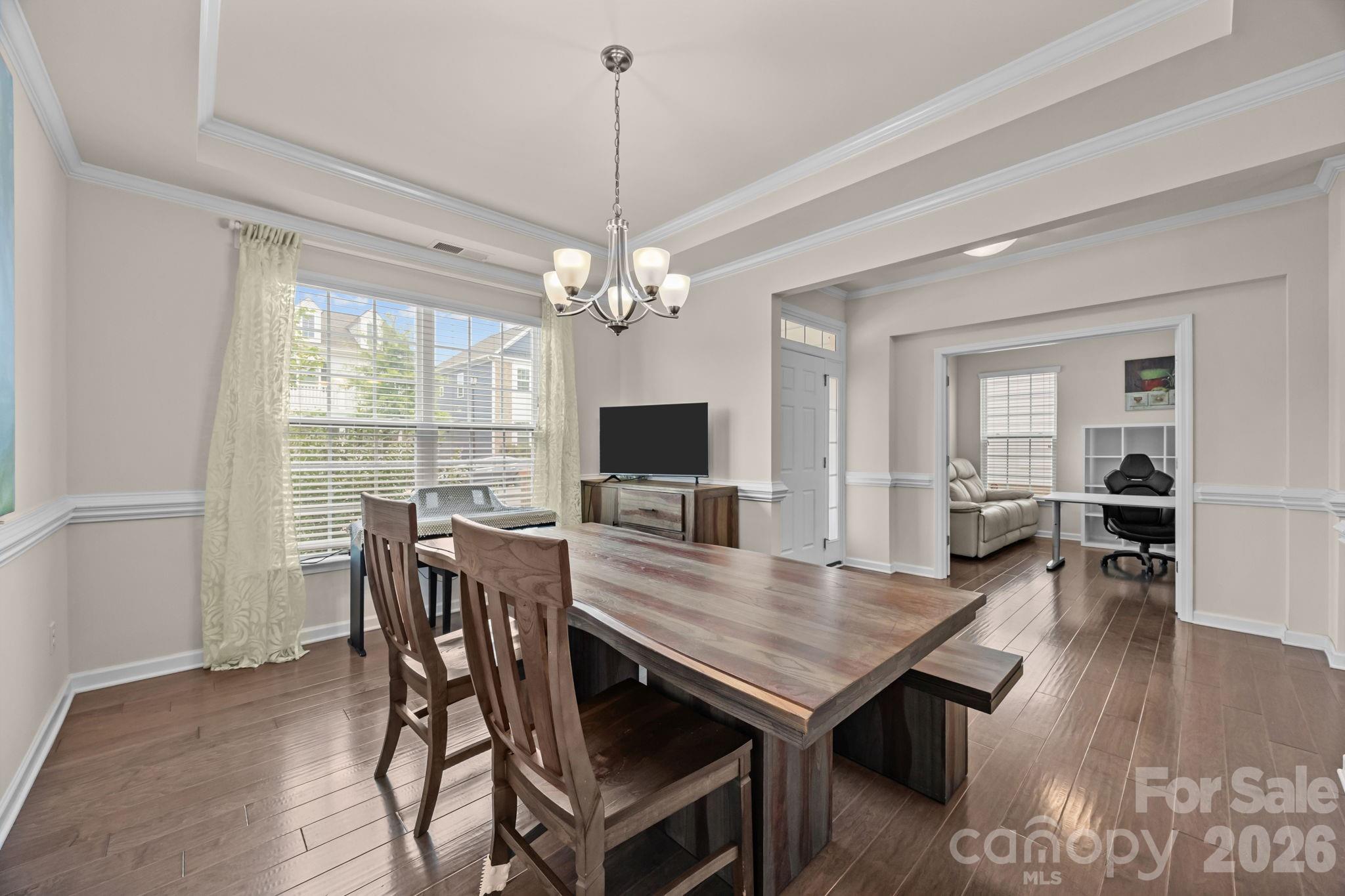 4028 Whittier Lane Tega Cay, SC 29708 - Photo 2 of 46 a view of a dining room with furniture window and wooden floor