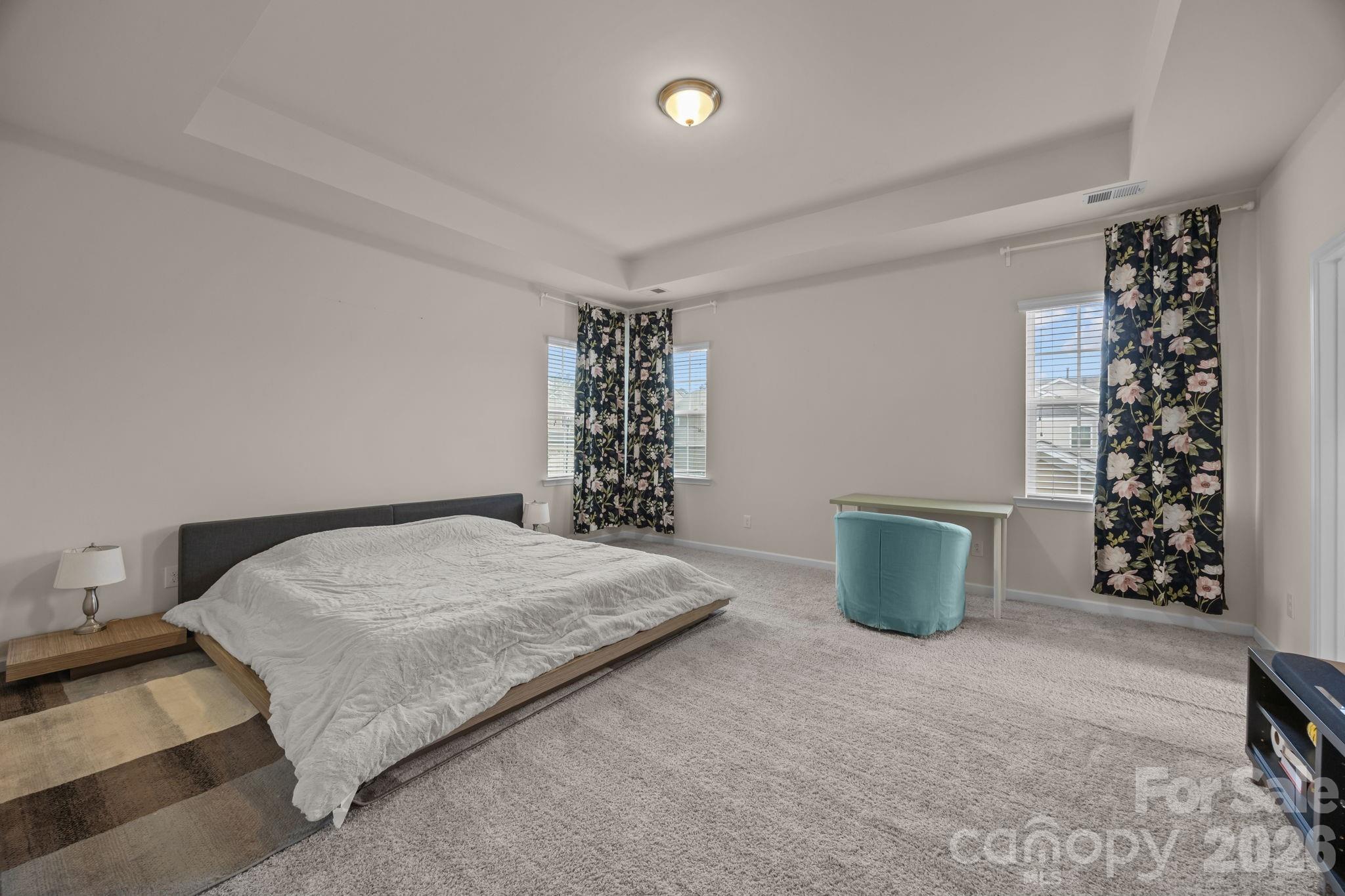 4028 Whittier Lane Tega Cay, SC 29708 - Photo 22 of 46 a spacious bedroom with a bed and a window