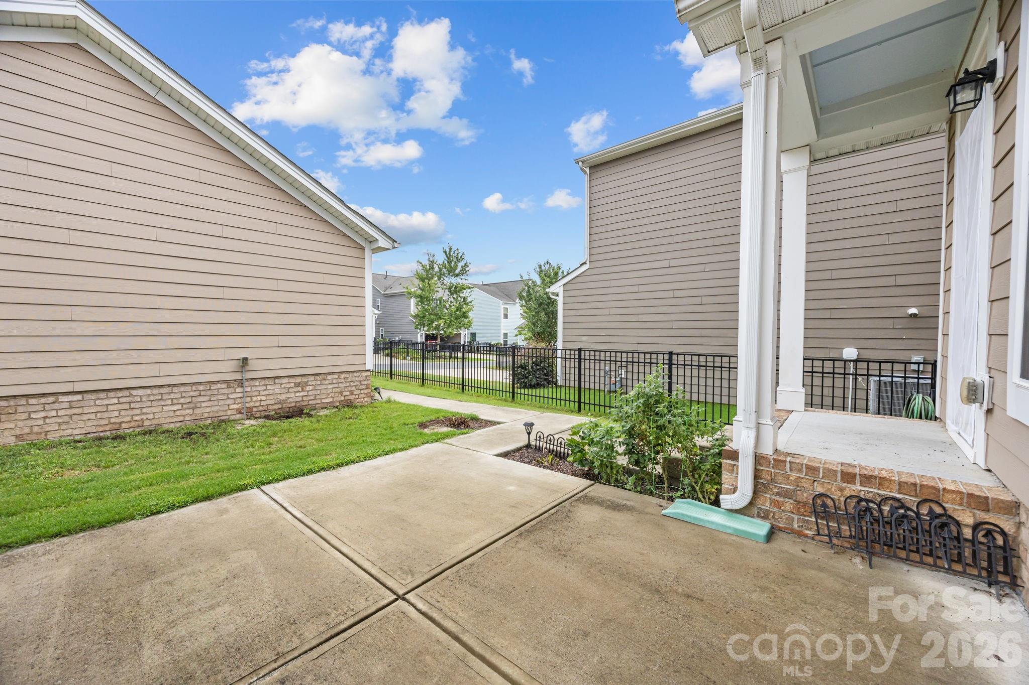 4028 Whittier Lane Tega Cay, SC 29708 - Photo 34 of 46 a view of a house with a yard