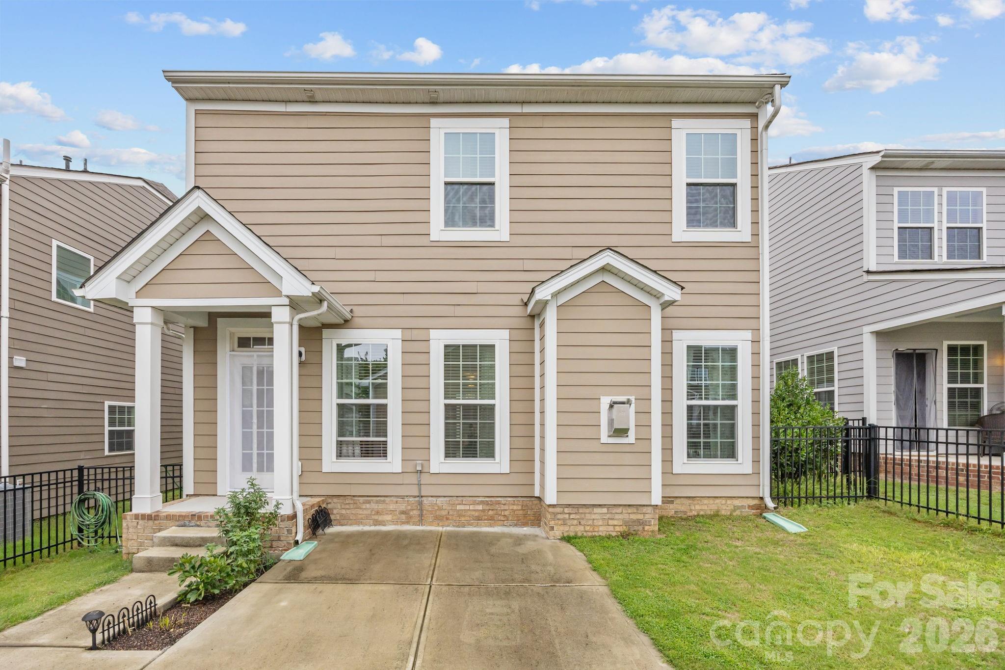 4028 Whittier Lane Tega Cay, SC 29708 - Photo 35 of 46 a front view of a house with a yard