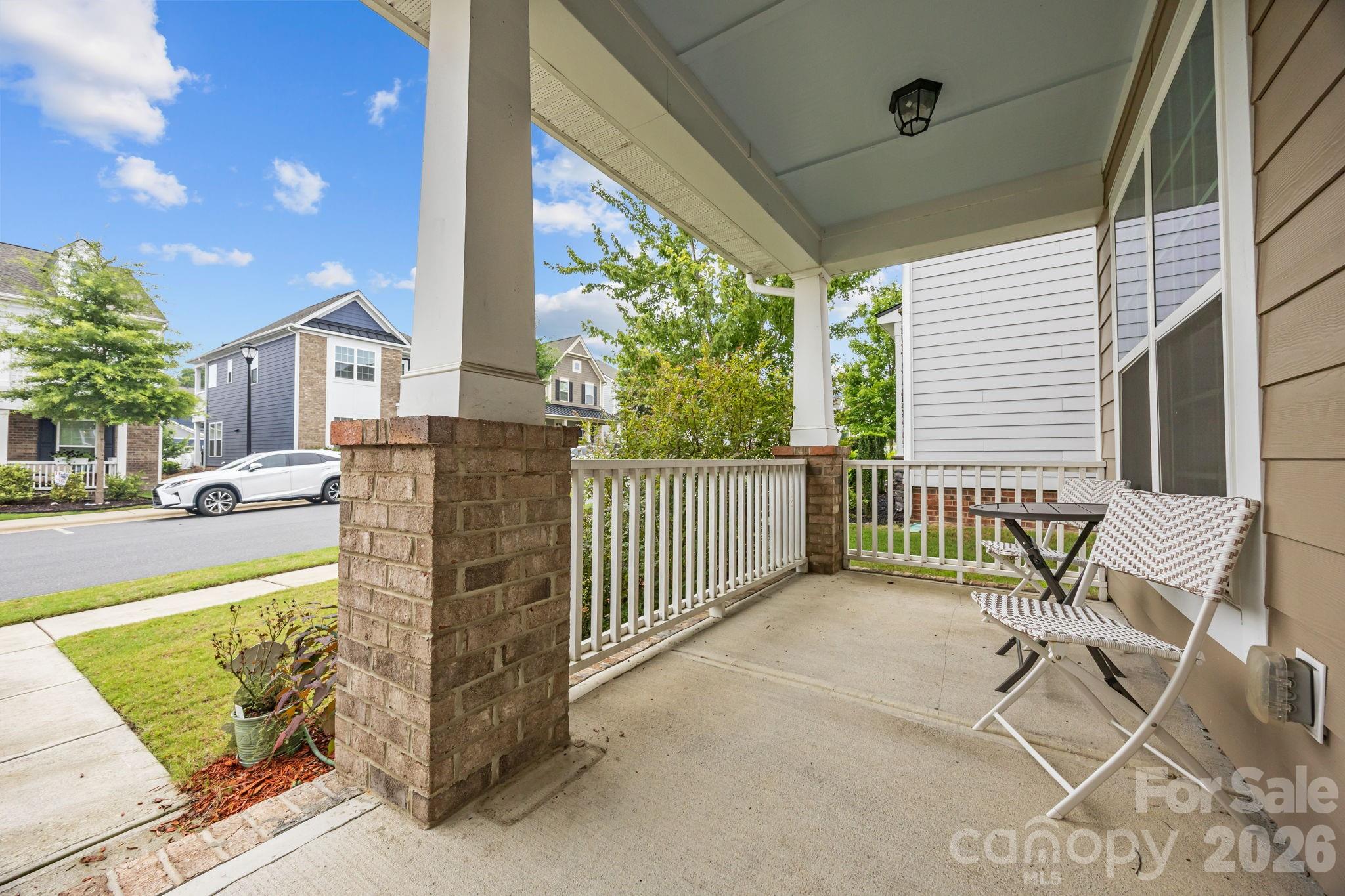 4028 Whittier Lane Tega Cay, SC 29708 - Photo 38 of 46 a view of a chairs and table in the balcony