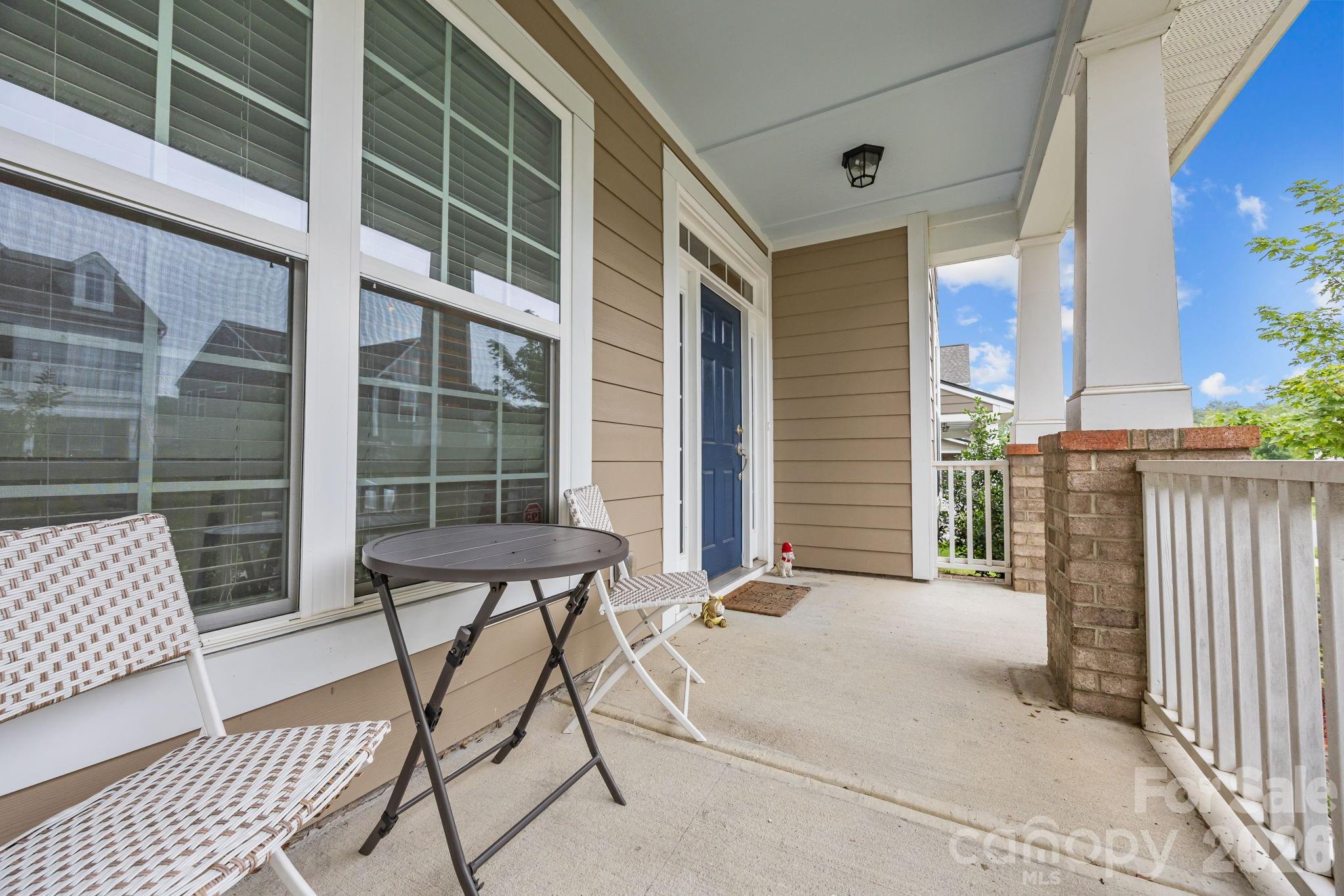 4028 Whittier Lane Tega Cay, SC 29708 - Photo 39 of 46 a balcony with table and chairs