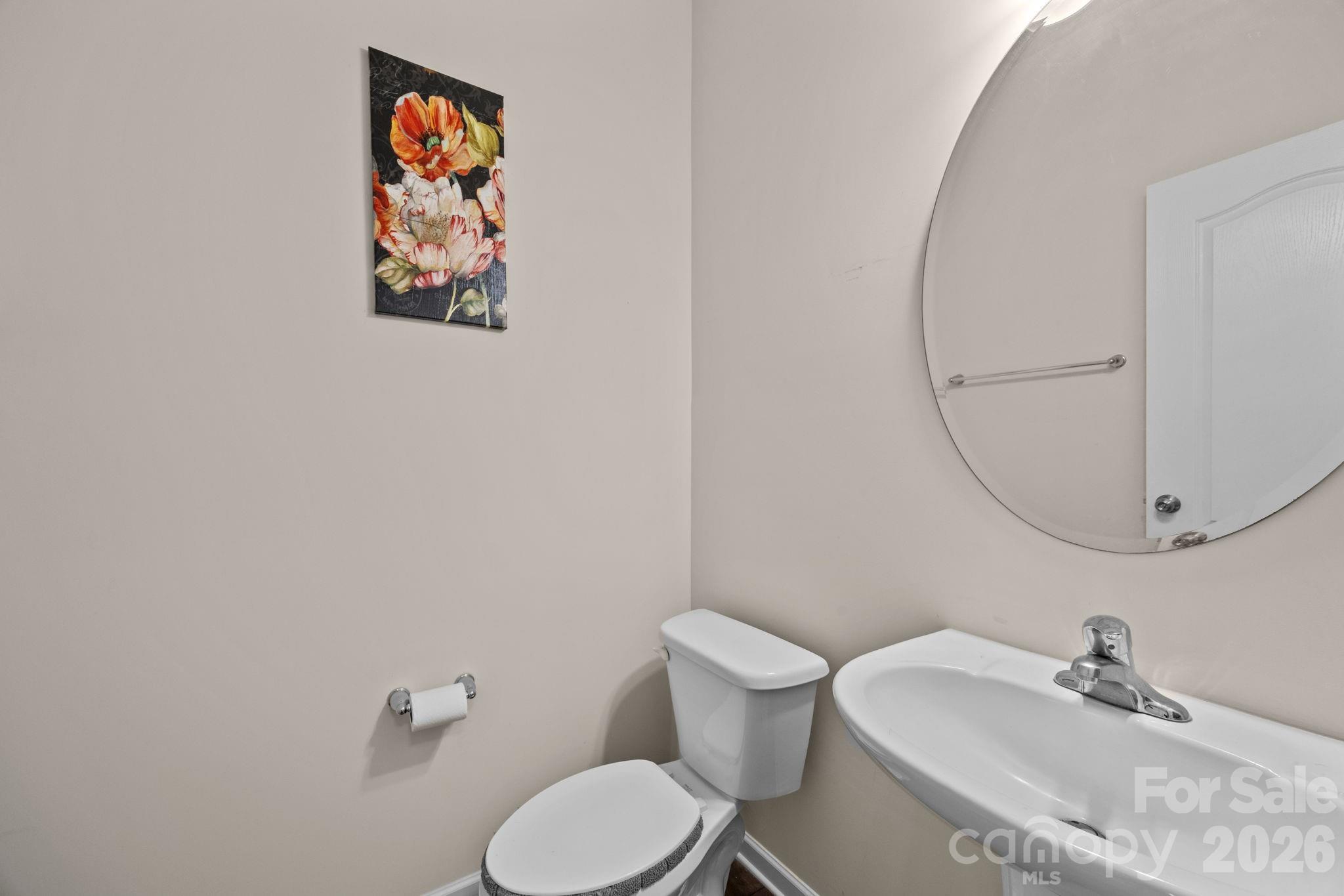 4028 Whittier Lane Tega Cay, SC 29708 - Photo 6 of 46 a bathroom with a toilet sink and mirror