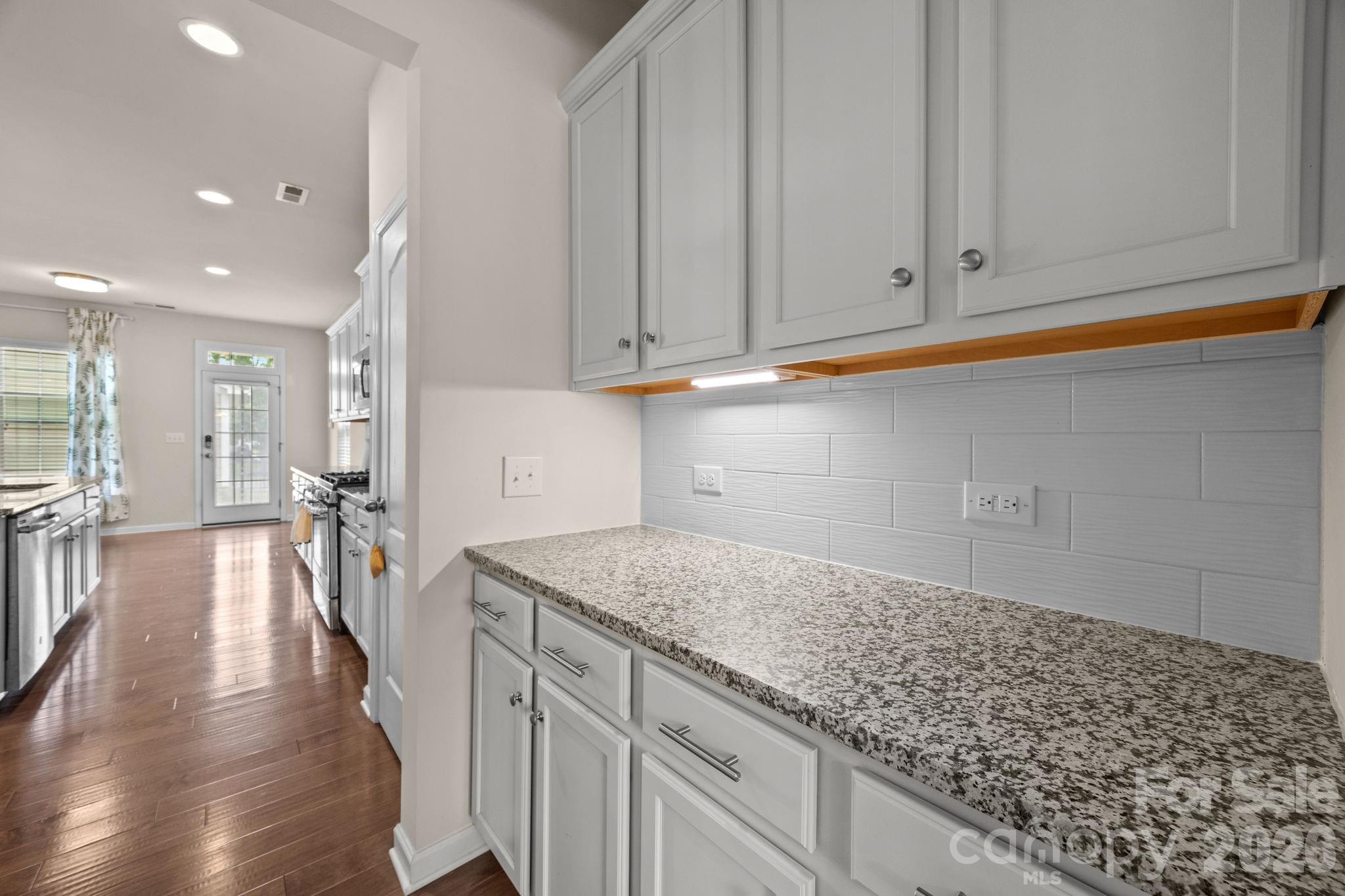 4028 Whittier Lane Tega Cay, SC 29708 - Photo 7 of 46 a kitchen with a sink and cabinets