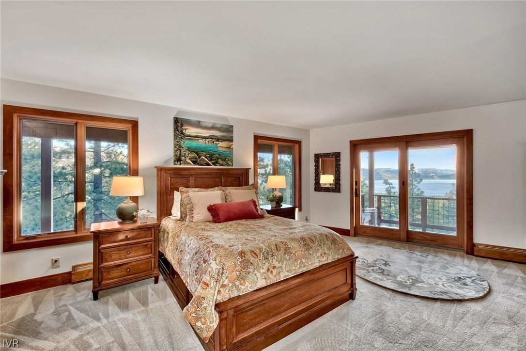 751 Tyner Way Incline Village, NV 89451 - Photo 18 of 29 a bedroom with a large bed and a couch next to a window