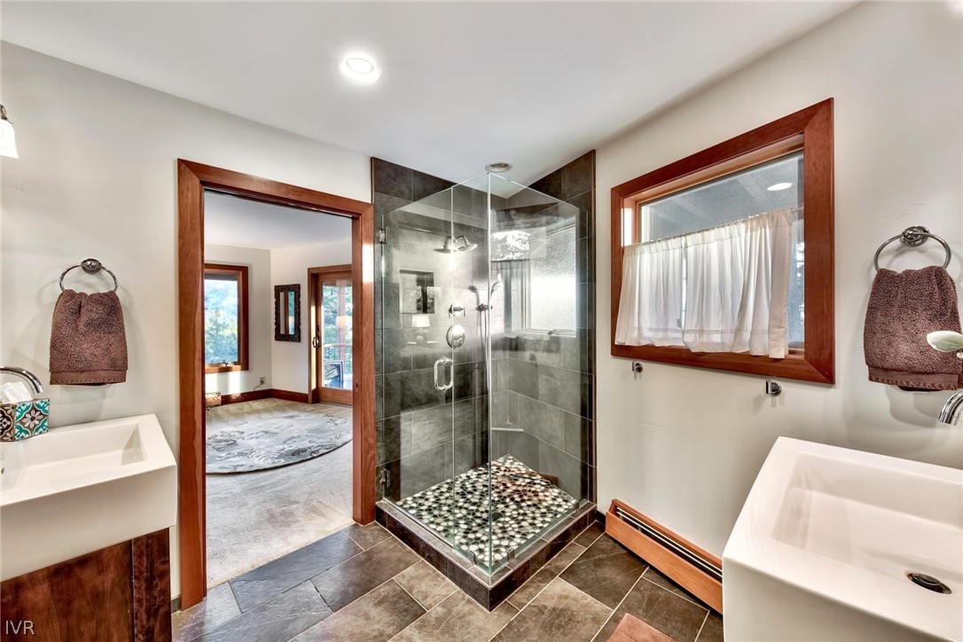 751 Tyner Way Incline Village, NV 89451 - Photo 19 of 29 a bathroom with a tub shower and mirror