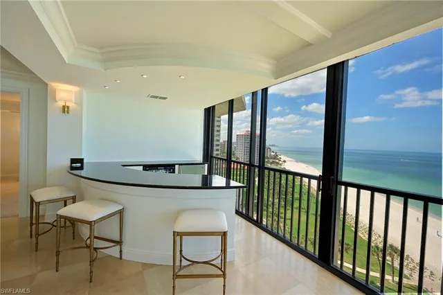 a view of a hallway with furniture
