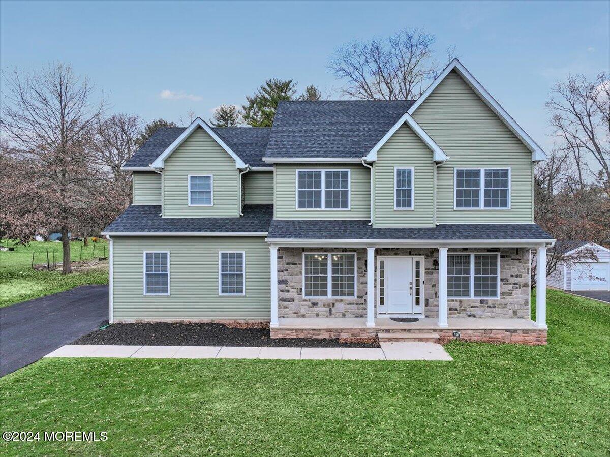 526 Vanderveer Road Bridgewater, NJ 08807 - Photo 1 of 1 a front view of a house with a yard and porch