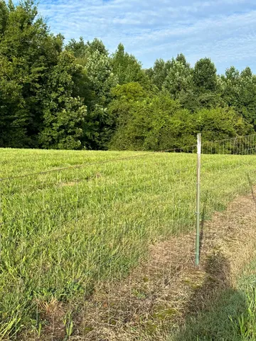 a view of a field with an outdoor space