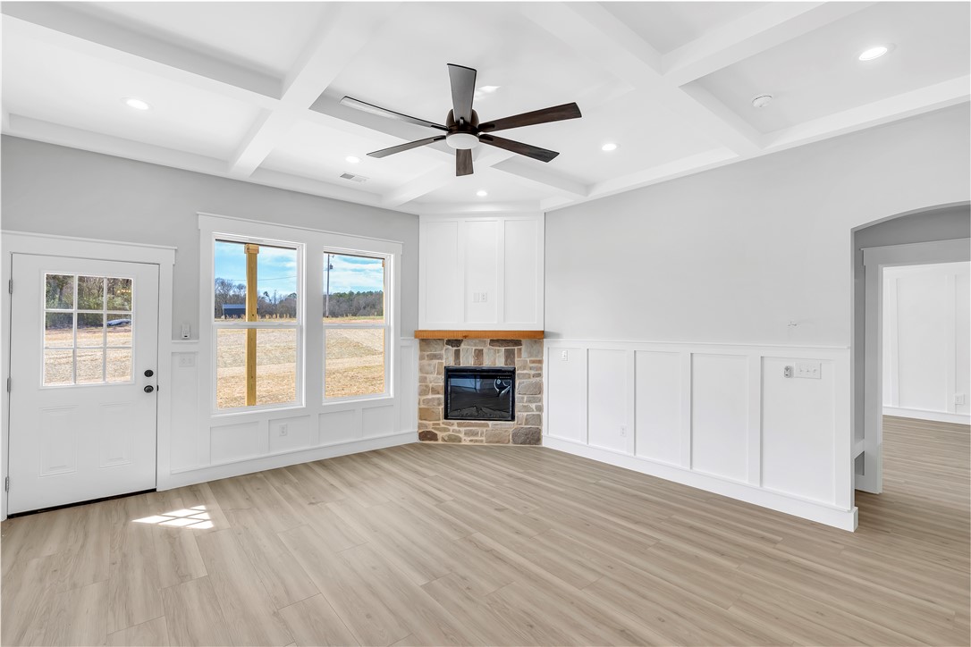2812 Smith McGee Road Iva, SC 29655 - Photo 10 of 26 This bright living space features elegant coffered ceilings and a captivating stone fireplace.