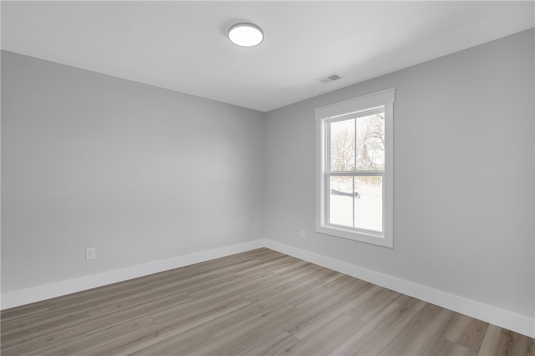 2812 Smith McGee Road Iva, SC 29655 - Photo 13 of 26 This spacious room features ample natural light and durable flooring, perfect for versatile living.