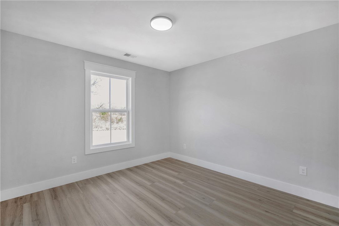 2812 Smith McGee Road Iva, SC 29655 - Photo 14 of 26 This bright room features a large window, offering ample natural light and a clean, modern aesthetic.