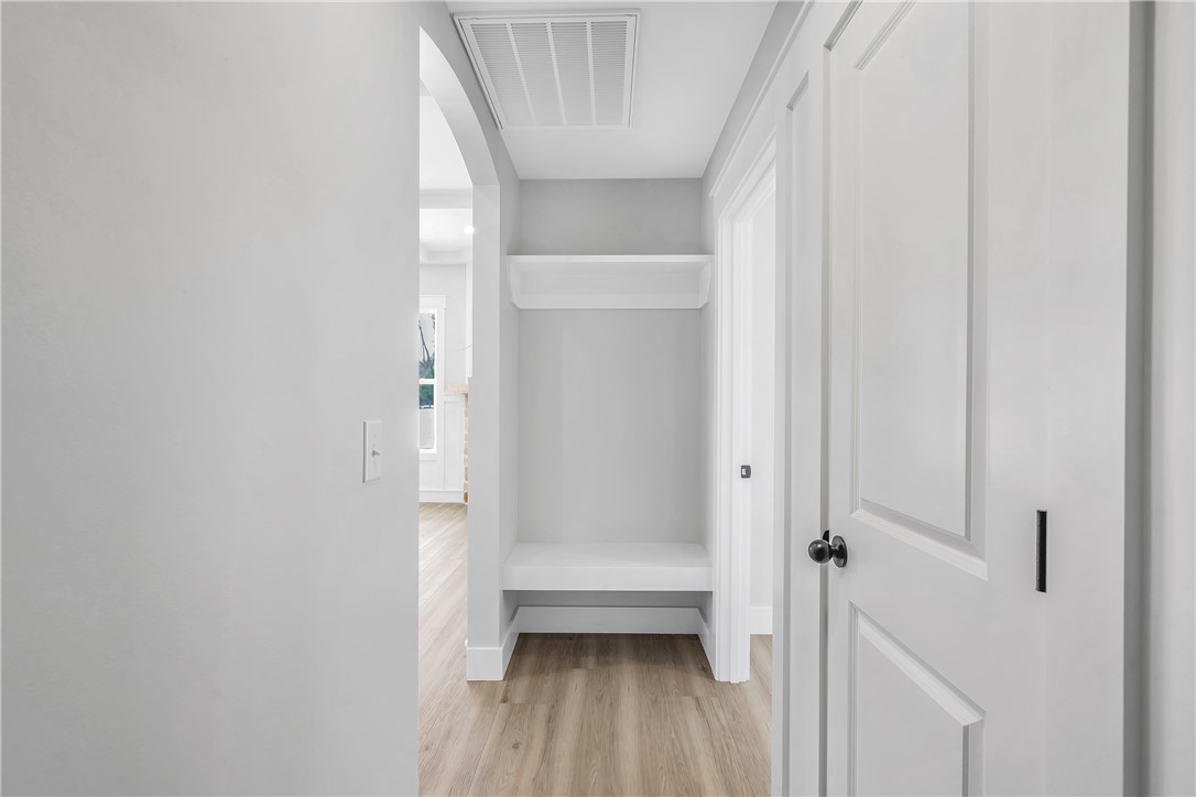2812 Smith McGee Road Iva, SC 29655 - Photo 16 of 26 This bright hallway features built-in storage and sleek doors, creating a welcoming and functional space.