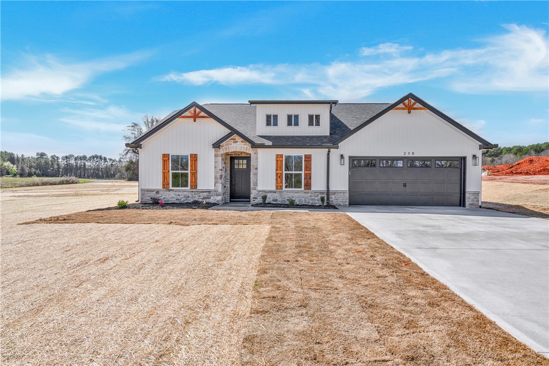 2812 Smith McGee Road Iva, SC 29655 - Photo 2 of 26 This newly constructed home boasts a welcoming facade with a convenient attached garage.