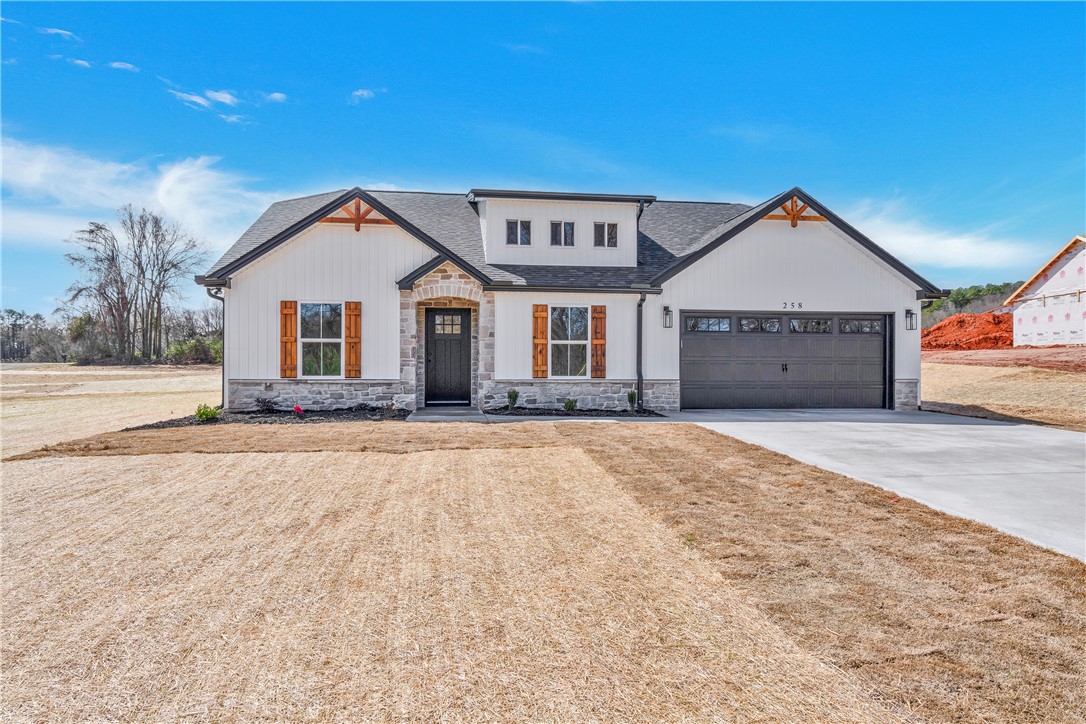 2812 Smith McGee Road Iva, SC 29655 - Photo 3 of 26 This newly constructed home features striking board and batten siding, stone accents, and an attached garage.