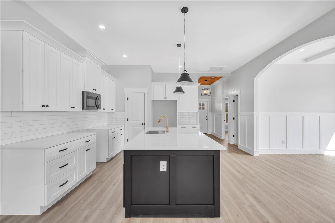 2812 Smith McGee Road Iva, SC 29655 - Photo 7 of 26 This bright kitchen features an expansive island and contemporary finishes, perfect for culinary endeavors.