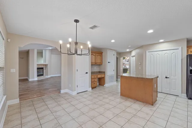 a view of a kitchen with furniture and a chandelier