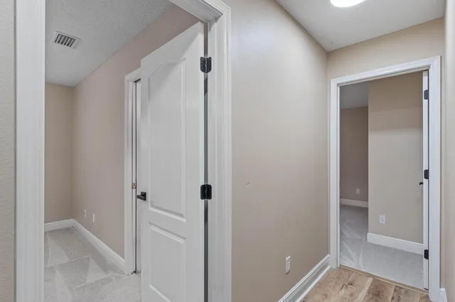 a bathroom with a shower and a glass door
