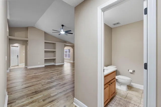 a bathroom with a toilet and a shower