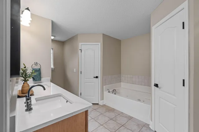 a bathroom with a sink and a bathtub