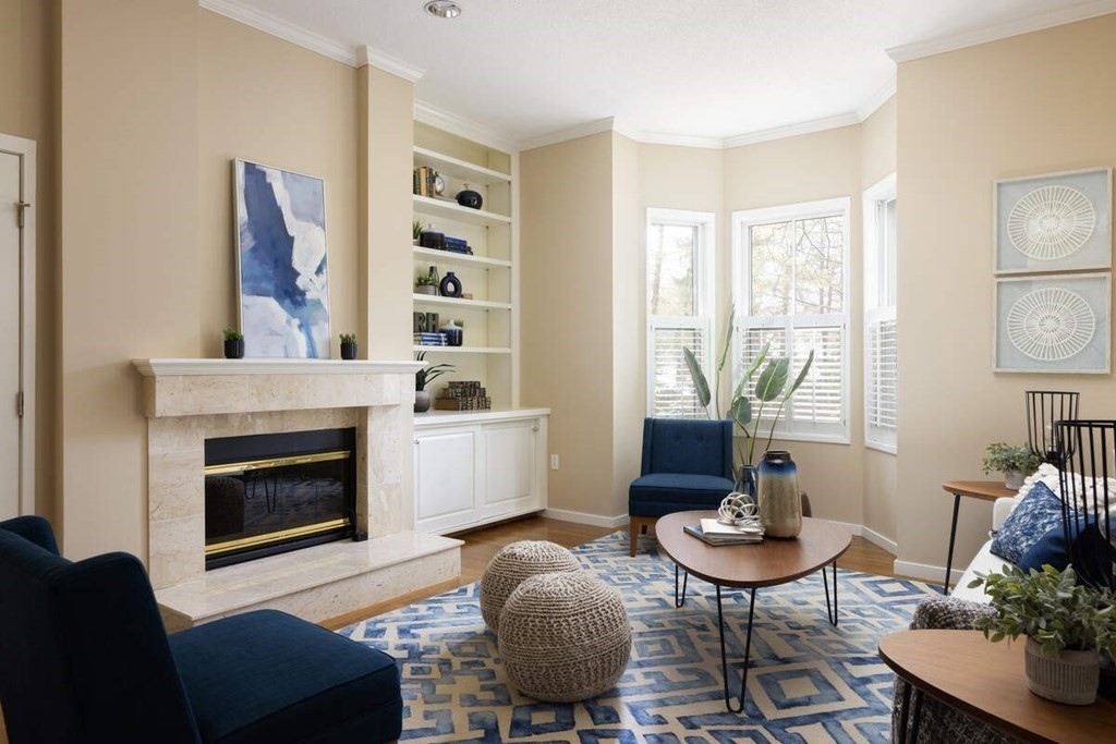 1175 Chestnut Street, Unit 2 Newton, MA 02464 - Photo 2 of 13 a living room with furniture and a fireplace