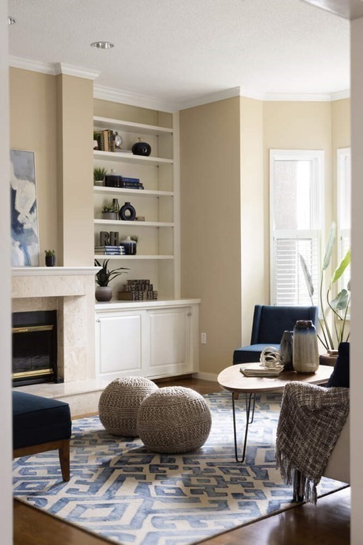 1175 Chestnut Street, Unit 2 Newton, MA 02464 - Photo 3 of 13 a living room with furniture and a fireplace