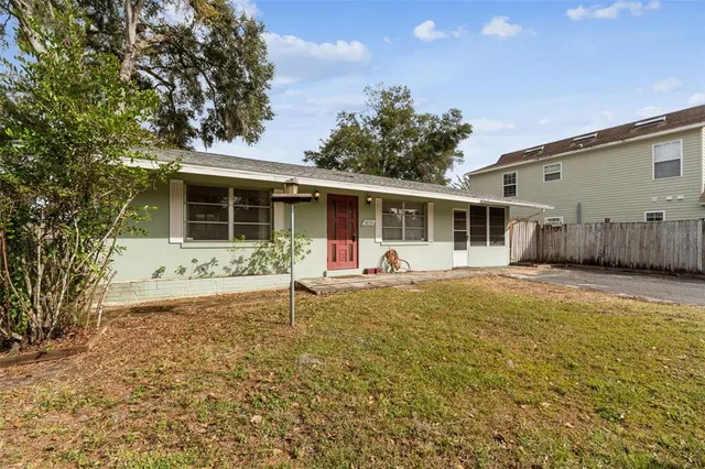a living room with furniture a rug and a lamp